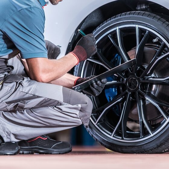 Tires And Wheels Inspection By Professional Automotive Technicia